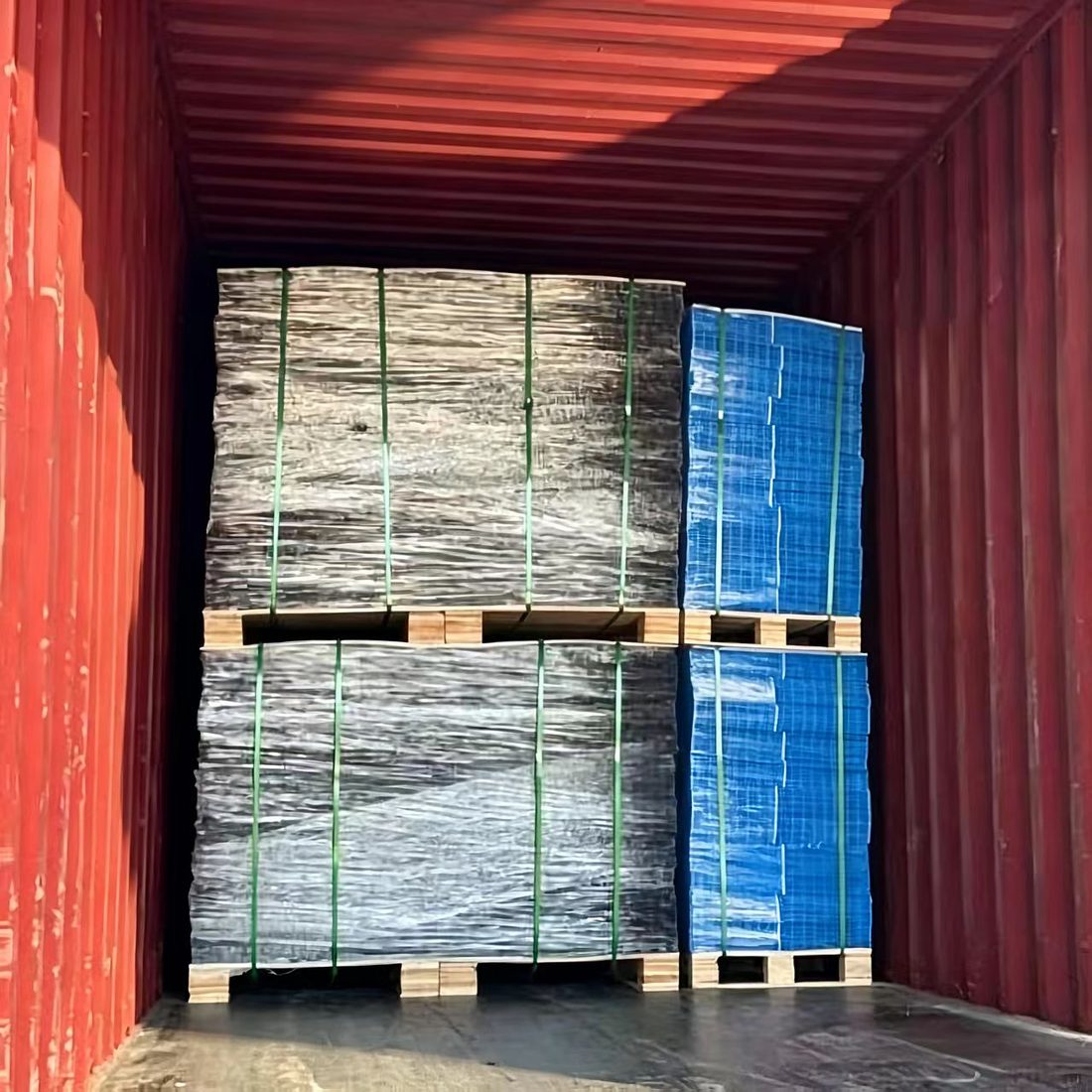 A 40ft container loaded with palletized rolls of galvanized and PVC-coated wire mesh strapped for export